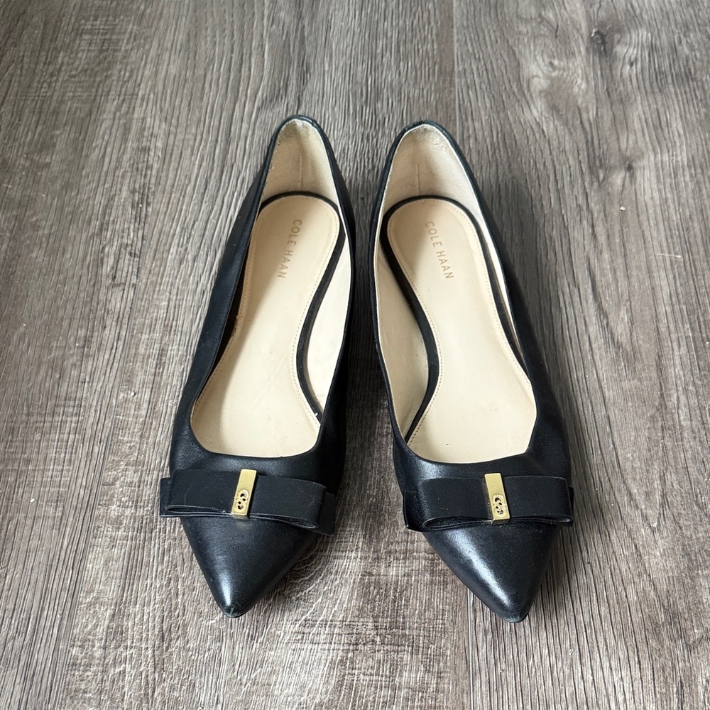 Cole Haan Black Pointed-Toe Leather Flats with Bow and Gold Accent